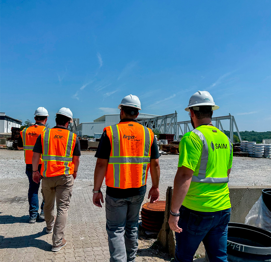 SAIM Employees with Logo Vests